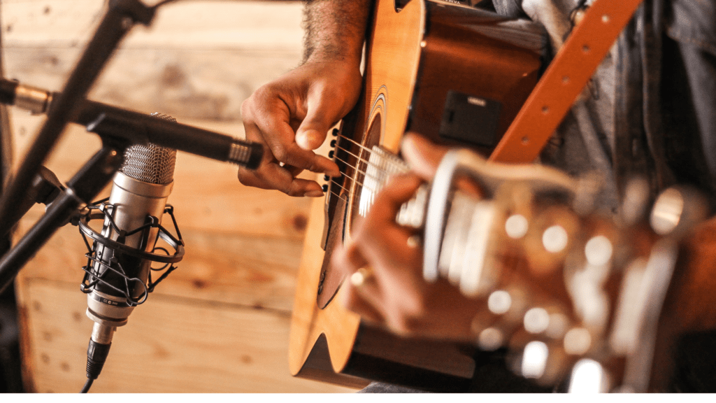 Acoustic Guitar being recorded by two microphones