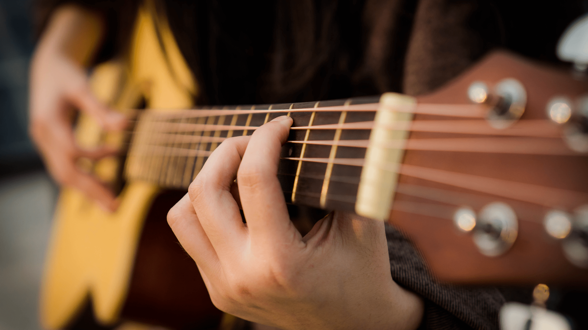 acoustic guitar being played